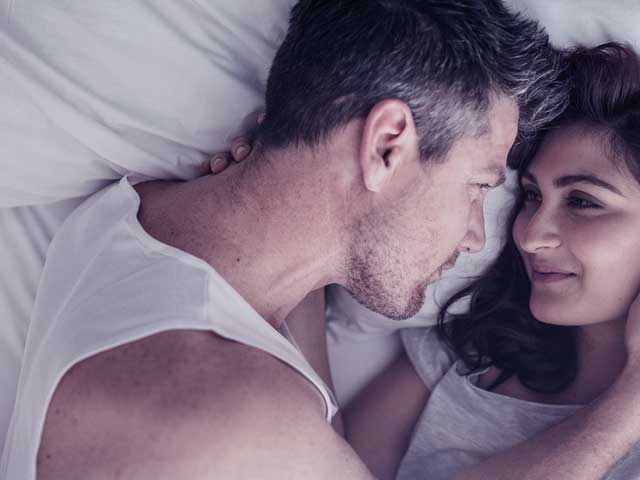 Couple in bed after using home remedies for premature ejaculation