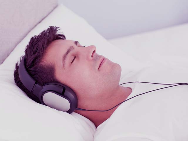 A man listening to a guided imagery recording for erectile dysfunction